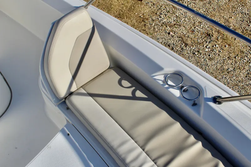 Slide: The Image of 2020 Boston Whaler 240 Dauntless boat seat with cup holders, beige upholstery. - 17