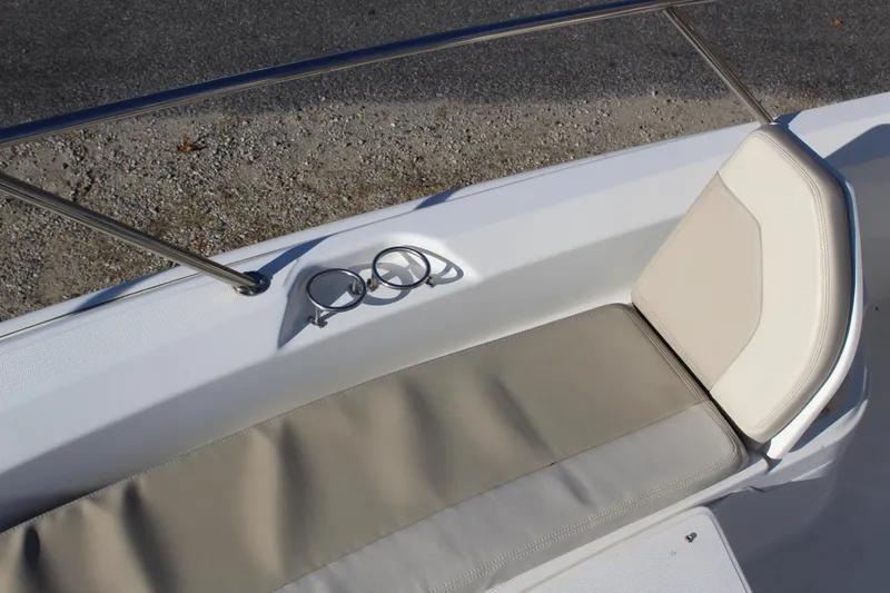 Slide: The Image of 2020 Boston Whaler 240 Dauntless boat seating area with cup holders and railing. - 18