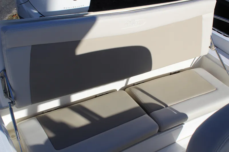 Slide: The Image of 2020 Boston Whaler 240 Dauntless boat seating with beige cushions and backrest. - 8