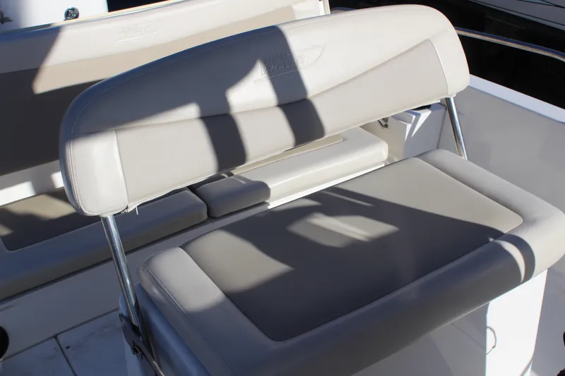 Slide: The Image of 2020 Boston Whaler 240 Dauntless boat seating area with cushioned bench. - 9