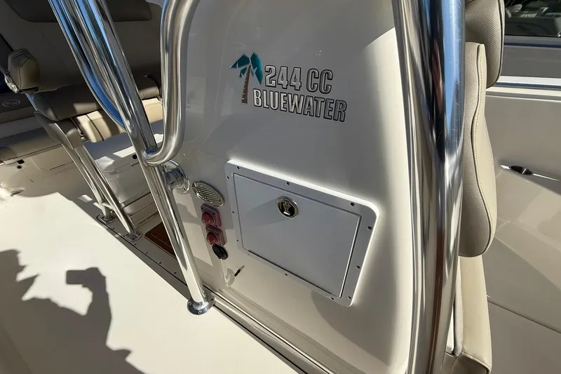 Slide: The Image of 2026 Key West 244 Center Console boat interior with Bluewater branding and seating. - 10