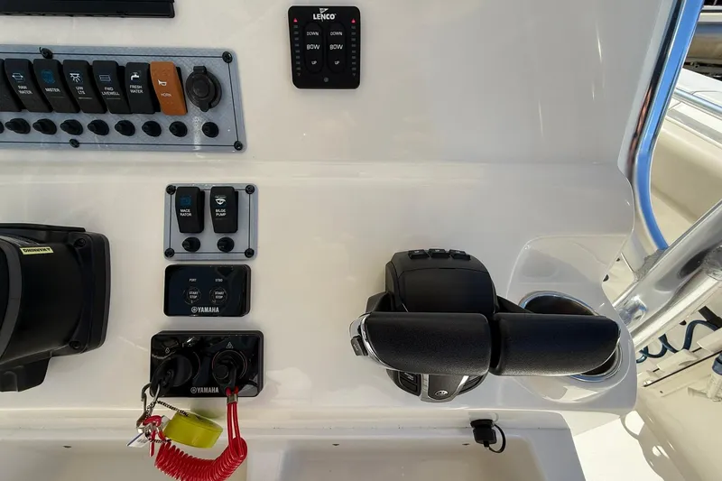 Slide: The Image of 2026 Key West 244 Center Console boat dashboard with Yamaha controls and switches. - 15