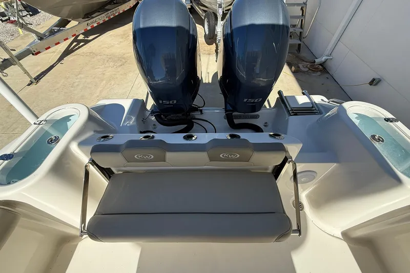 Slide: The Image of 2026 Key West 244 Center Console boat with dual engines and seating area. - 19