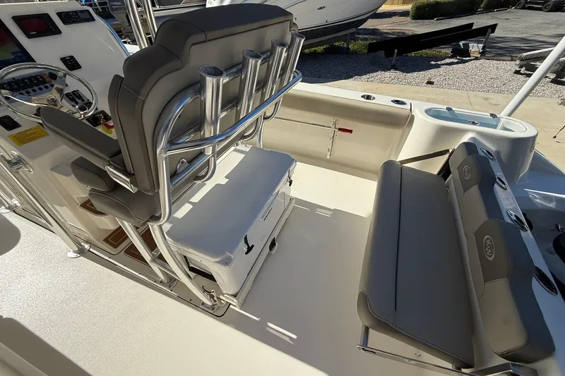 Slide: The Image of 2026 Key West 244 Center Console boat interior with seating and control panel. - 20