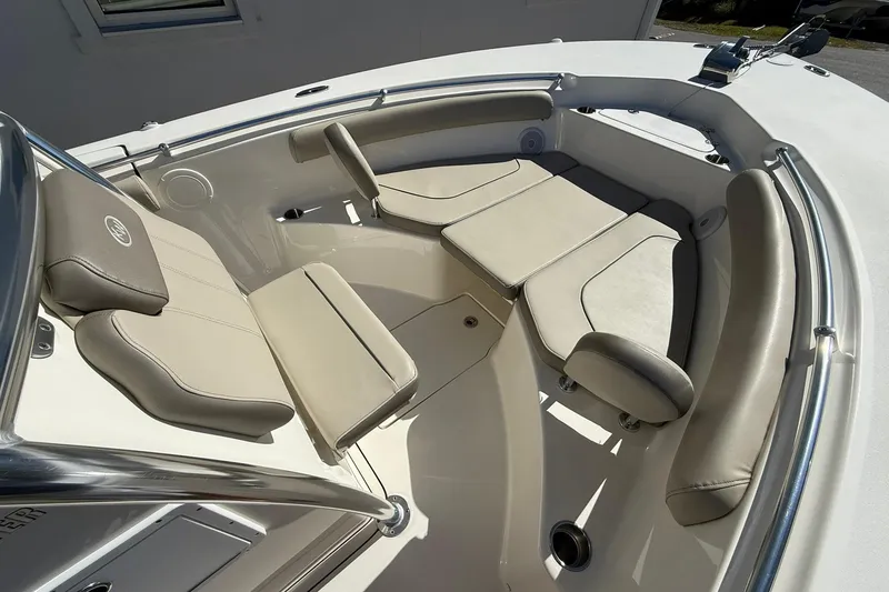 Slide: The Image of 2026 Key West 244 Center Console boat with beige cushioned seating in the bow area. - 5