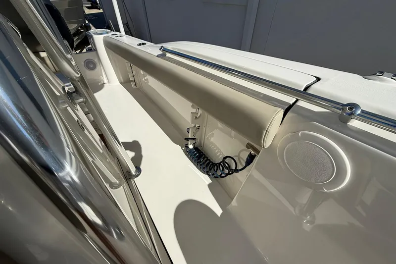 Slide: The Image of 2026 Key West 244 Center Console boat interior with seating and speaker detail. - 8