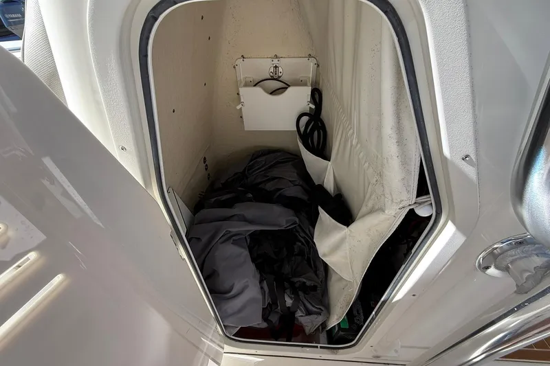 Slide: The Image of Storage compartment inside 2026 Key West 244 Center Console boat, featuring organized equipment. - 9