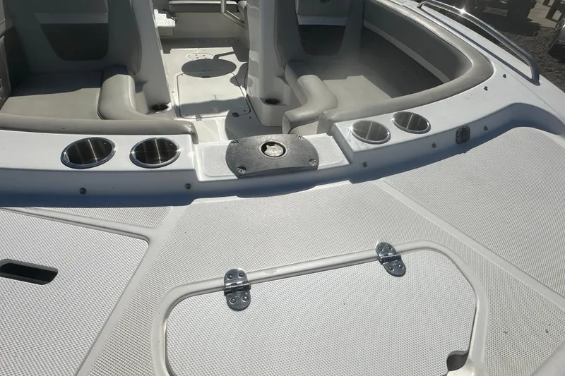 Slide: The Image of 2020 Hurricane SunDeck Sport 192 RL OB boat interior with cup holders and seating. - 11