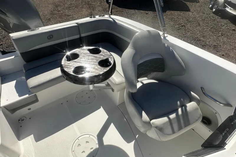 Slide: The Image of 2020 Hurricane SunDeck Sport 192 RL OB boat interior with seating and table. - 16