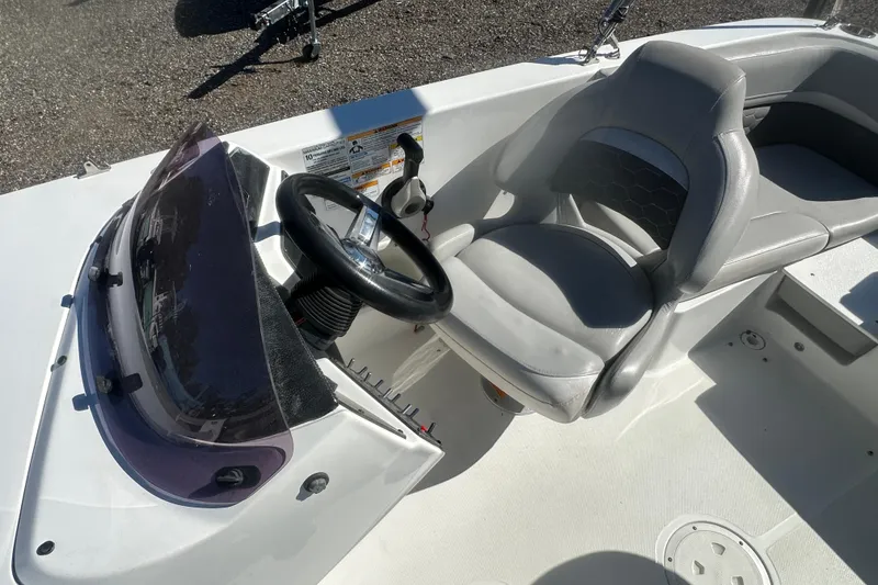 Slide: The Image of 2020 Hurricane SunDeck Sport 192 RL OB boat cockpit with steering wheel and seating. - 18