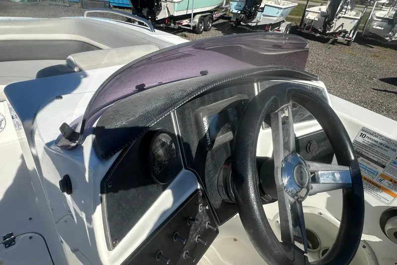 Slide: The Image of 2020 Hurricane SunDeck Sport 192 RL OB boat dashboard with steering wheel and controls. - 19