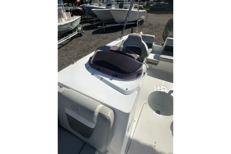 Slide: The Image of 2020 Hurricane SunDeck Sport 192 RL OB boat interior with seating and console. - 21