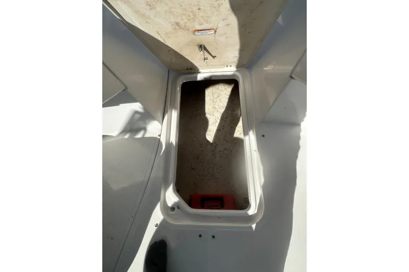 Slide: The Image of Open storage compartment on 2020 Hurricane SunDeck Sport 192 RL OB boat. - 22