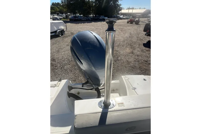 Slide: The Image of 2020 Hurricane SunDeck Sport 192 RL OB boat with outboard motor in a parking area. - 25