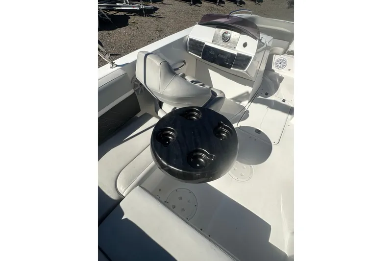 Slide: The Image of 2020 Hurricane SunDeck Sport 192 RL OB boat interior with seating and cup holders. - 28