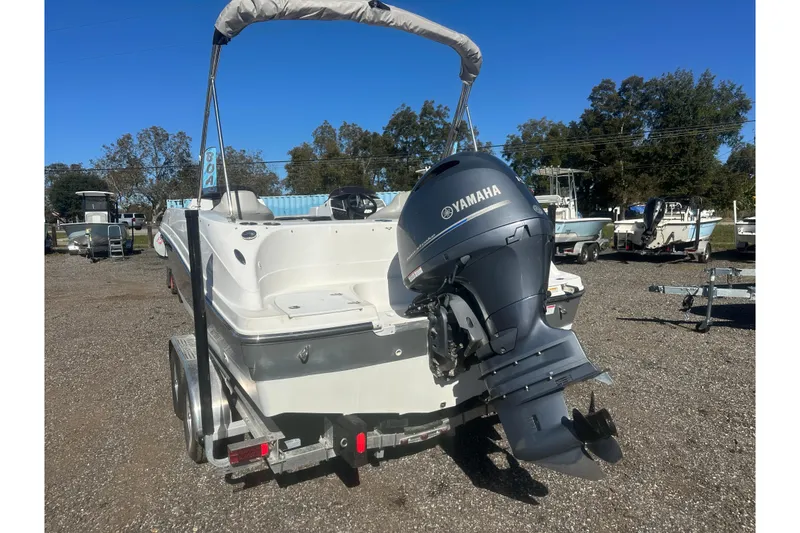 Slide: The Image of 2020 Hurricane SunDeck Sport 192 RL OB boat with Yamaha outboard motor on trailer. - 4