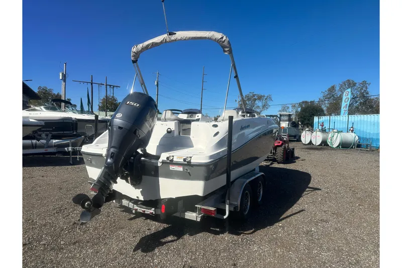 Slide: The Image of 2020 Hurricane SunDeck Sport 192 RL OB boat with outboard motor on trailer. - 5