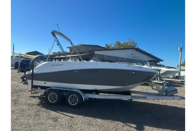 Slide: The Image of 2020 Hurricane SunDeck Sport 192 RL OB boat on trailer, parked outdoors. - 7