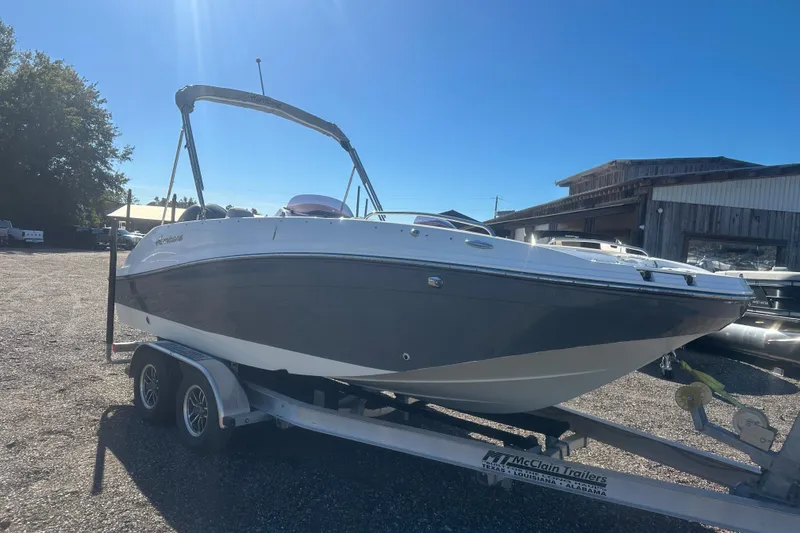 Slide: The Image of 2020 Hurricane SunDeck Sport 192 RL OB boat on trailer, parked outdoors. - 8