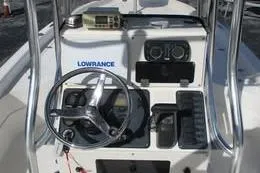 Slide: The Image of Center console of 2006 Shearwater Boatworks Z2400 with steering wheel and navigation equipment. - 5