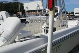 Slide: The Image of 2006 Shearwater Boatworks Z2400 with white seating and fishing rod holders. - 7