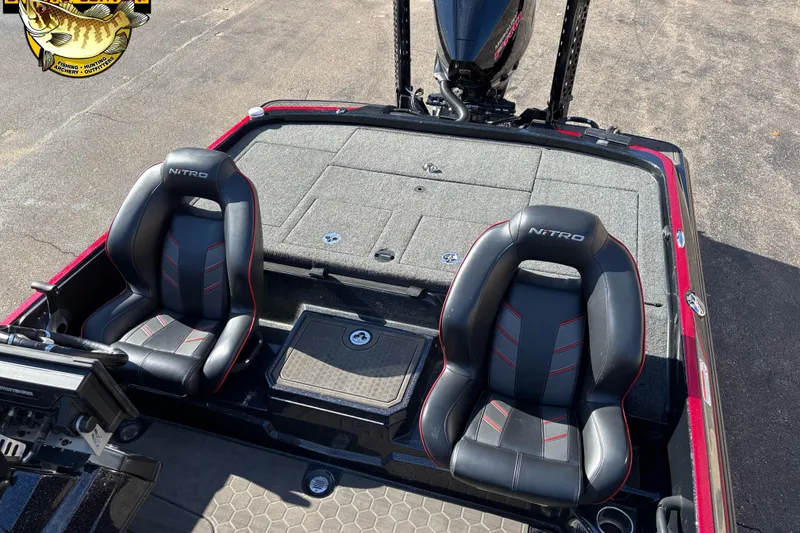 Slide: The Image of 2024 Nitro Z21 XL boat interior with two black seats and fishing deck. - 11