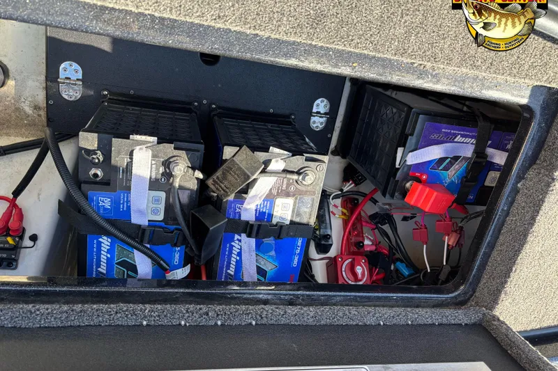 Slide: The Image of 2024 Nitro Z21 XL boat battery compartment with multiple batteries and wiring. - 12