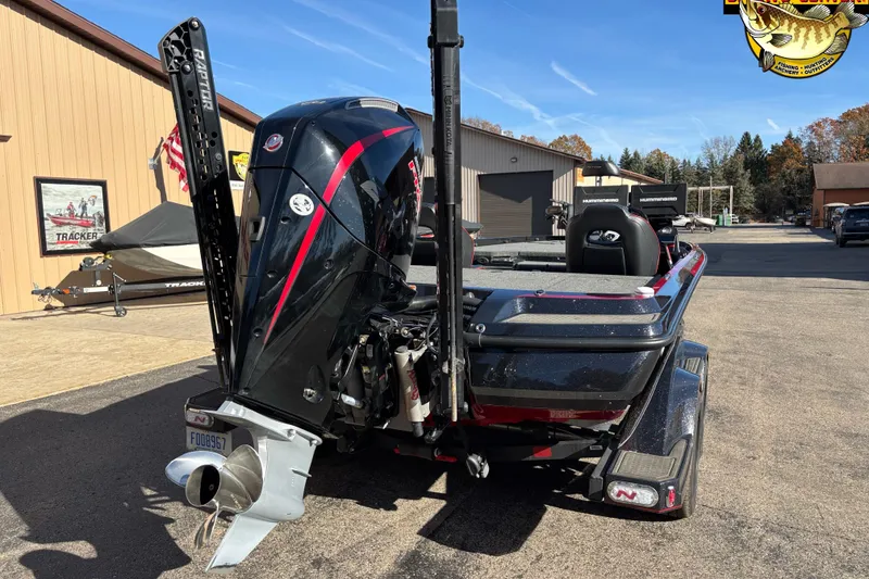 Slide: The Image of 2024 Nitro Z21 XL boat with powerful outboard motor, parked outdoors. - 5