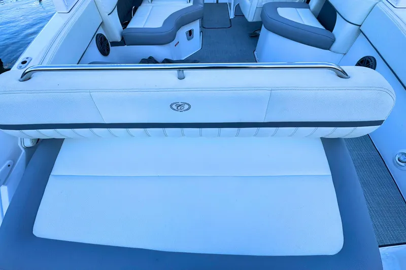 Slide: The Image of 2019 Cobalt 25SC boat interior with white and gray seating. - 11