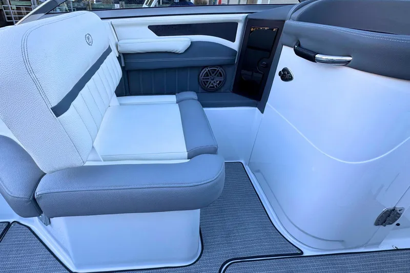 Slide: The Image of 2019 Cobalt 25SC boat interior with gray and white seating. - 18