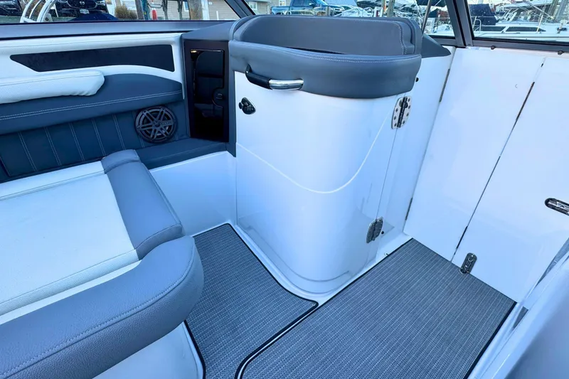 Slide: The Image of 2019 Cobalt 25SC boat interior with gray seating and modern design. - 19