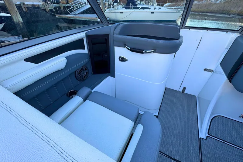 Slide: The Image of Interior of a 2019 Cobalt 25SC boat with sleek seating and modern design. - 20
