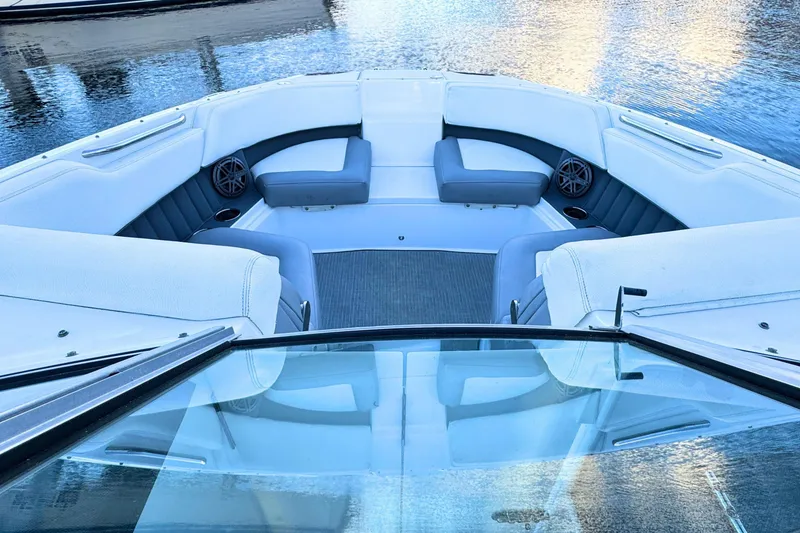 Slide: The Image of 2019 Cobalt 25SC boat interior with spacious seating and water view. - 27