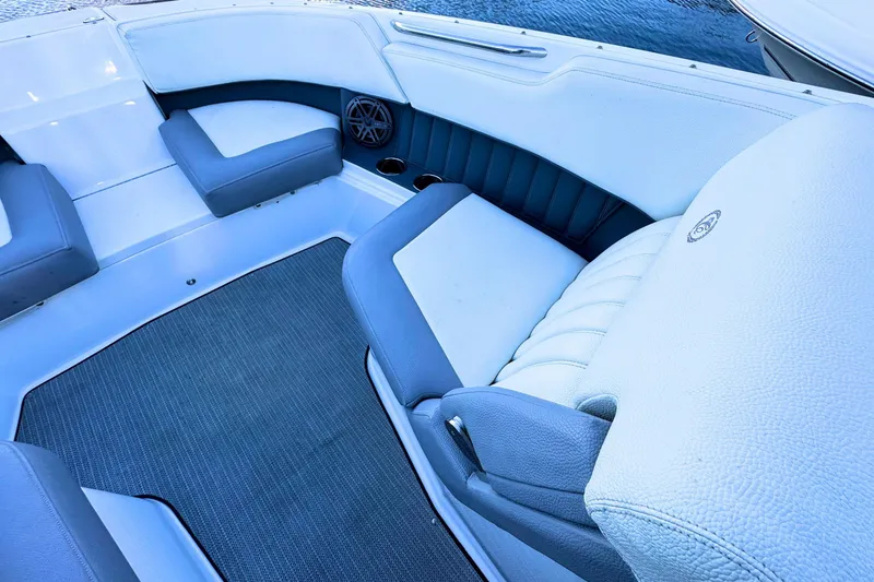 Slide: The Image of 2019 Cobalt 25SC boat interior with cushioned seating and marine carpet. - 29