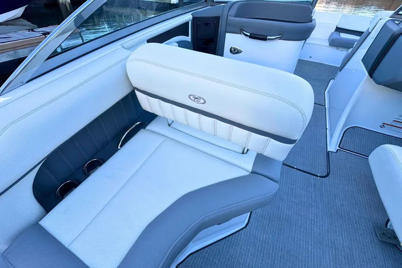Slide: The Image of 2019 Cobalt 25SC boat interior with white and gray seating. - 35