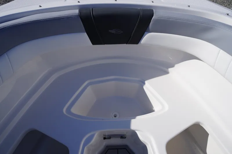 Slide: The Image of Interior view of 2026 Chaparral 23 SSi OB boat, featuring sleek white seating. - 13