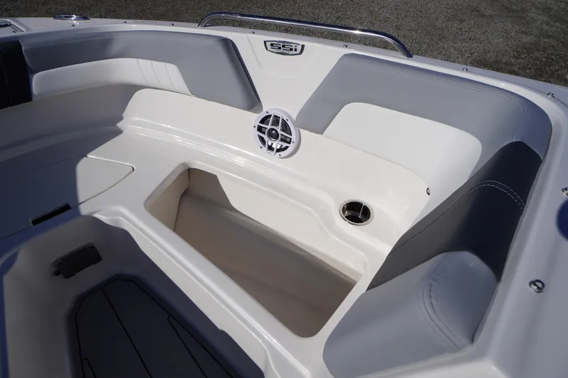 Slide: The Image of Interior view of 2026 Chaparral 23 SSi OB boat, featuring seating and speaker. - 15