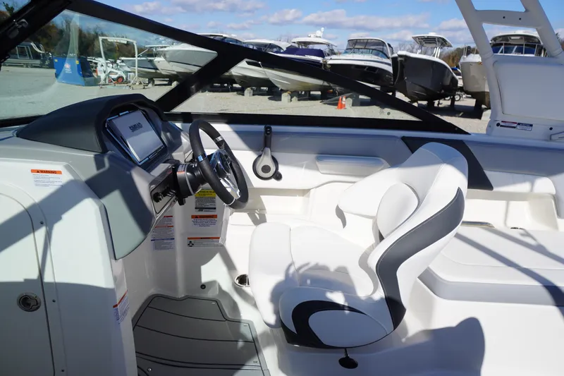 Slide: The Image of Interior of 2026 Chaparral 23 SSi OB boat with modern steering and seating. - 21