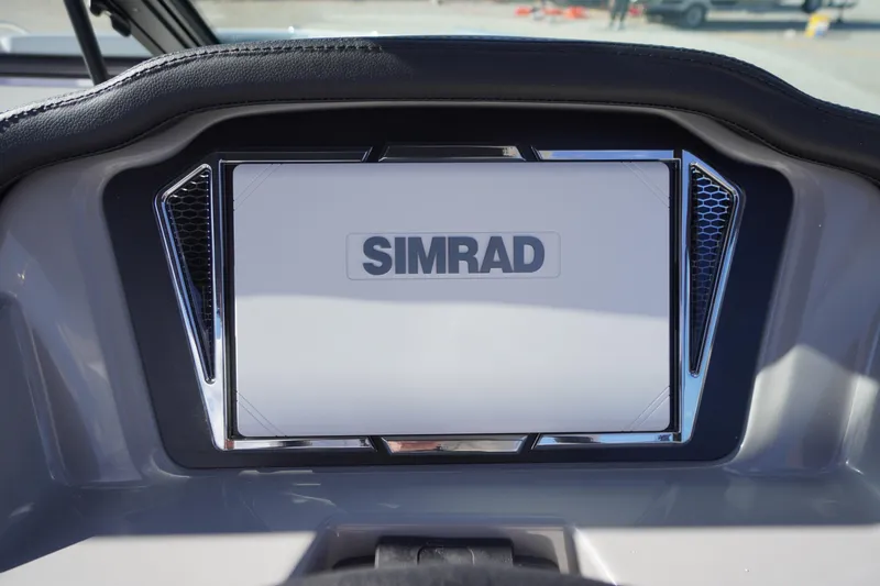 Slide: The Image of Simrad display on 2026 Chaparral 23 SSi OB boat dashboard. - 24