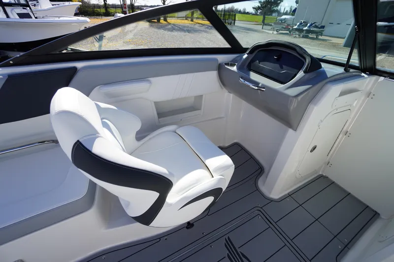 Slide: The Image of Interior of 2026 Chaparral 23 SSi OB boat with sleek seating and modern dashboard. - 35