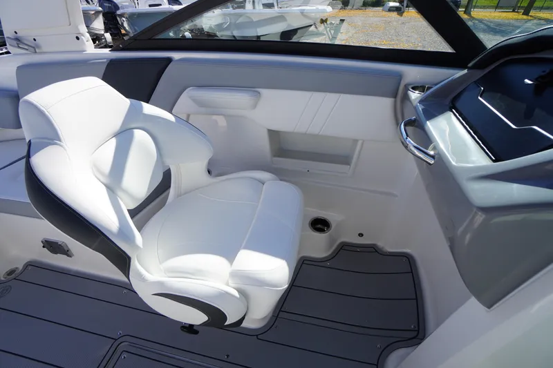 Slide: The Image of 2026 Chaparral 23 SSi OB boat interior with white seating and modern dashboard. - 36