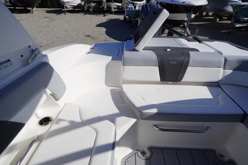 Slide: The Image of 2026 Chaparral 23 SSi OB boat interior with white seating and modern design. - 45