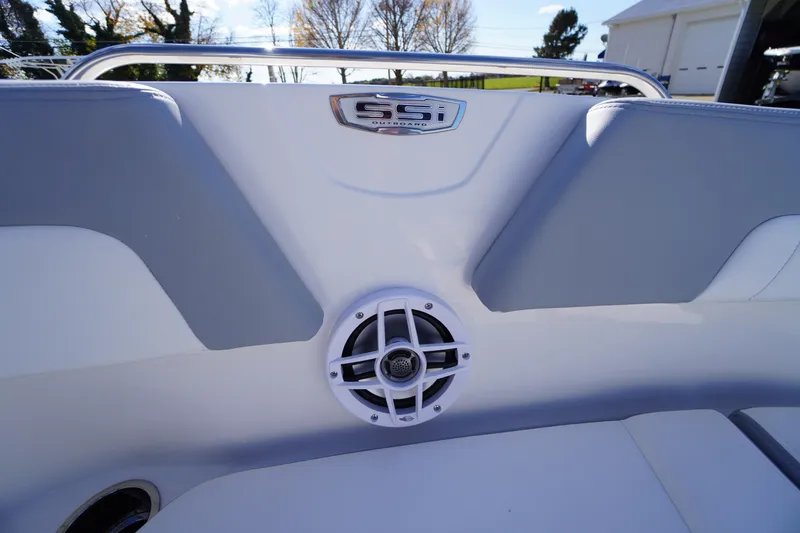 Slide: The Image of 2026 Chaparral 23 SSi OB boat interior with speaker and logo detail. - 9