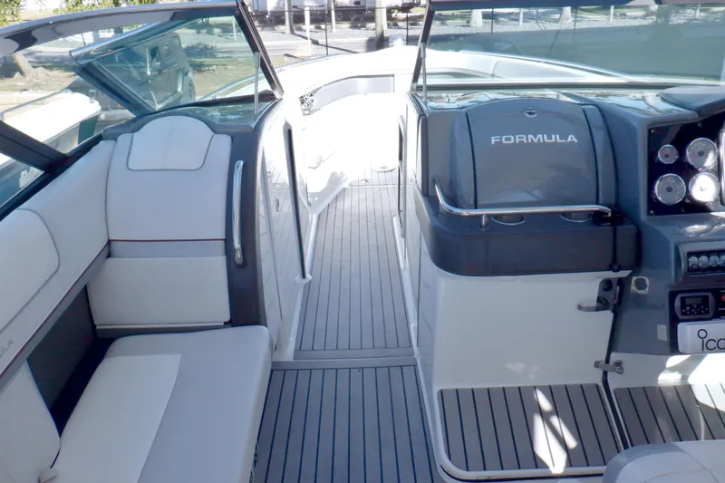 Slide: The Image of Storage compartment in 2015 Formula 350 Crossover Bowrider boat, featuring organized space. - 13