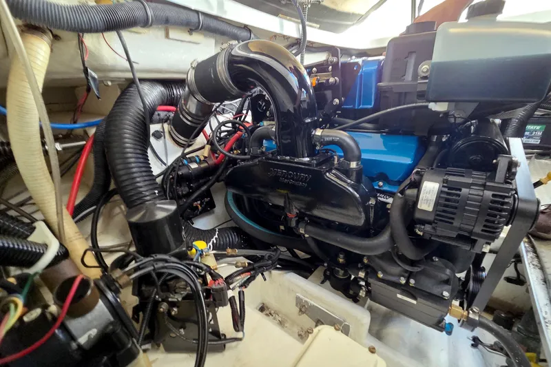 Slide: The Image of Engine compartment of a 2015 Formula 350 Crossover Bowrider, showcasing detailed components. - 48