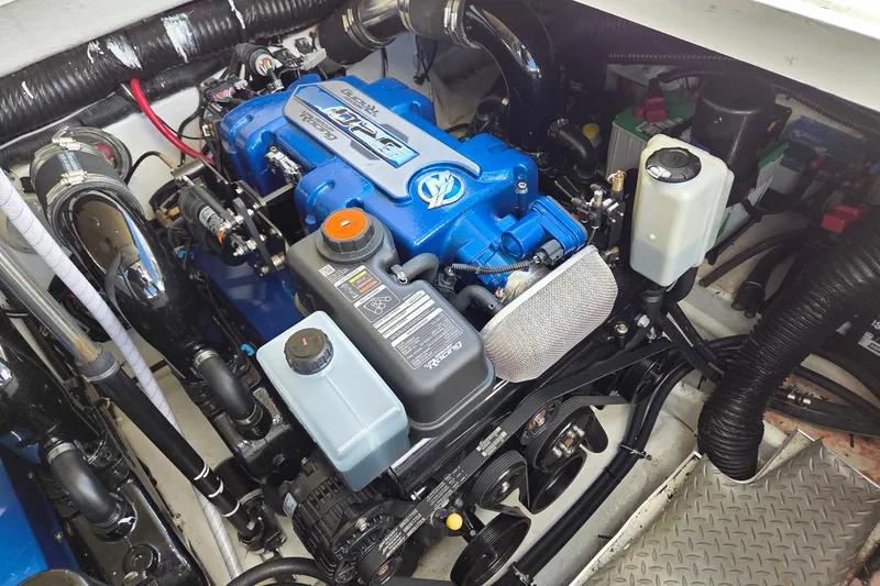 Slide: The Image of Engine compartment of a 2015 Formula 350 Crossover Bowrider, showcasing detailed components. - 52