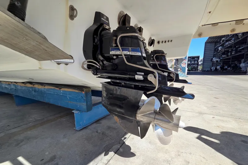 Slide: The Image of 2015 Formula 350 Crossover Bowrider with dual propellers in a marina setting. - 57