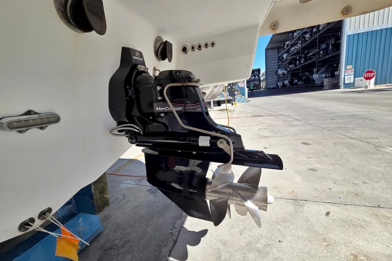 Slide: The Image of 2015 Formula 350 Crossover Bowrider with MerCruiser outdrive in a marina setting. - 59