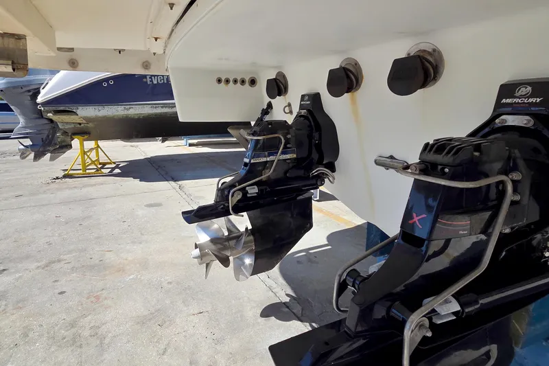 Slide: The Image of 2015 Formula 350 Crossover Bowrider with Mercury outboard engines in a boatyard. - 61