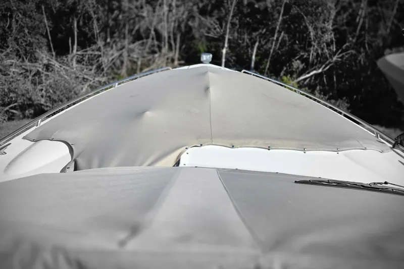 Slide: The Image of 2015 Formula 350 Crossover Bowrider with covered bow, surrounded by trees. - 66